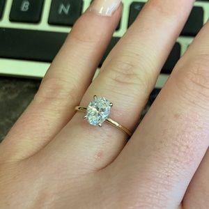 Twotone hidden halo oval solitaire engagement ring